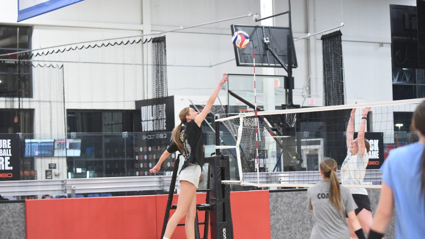 Boomtown players in live volleyball play at drop-in night